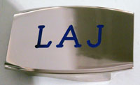 Devanet deep etched and colour filled initials into buckle face